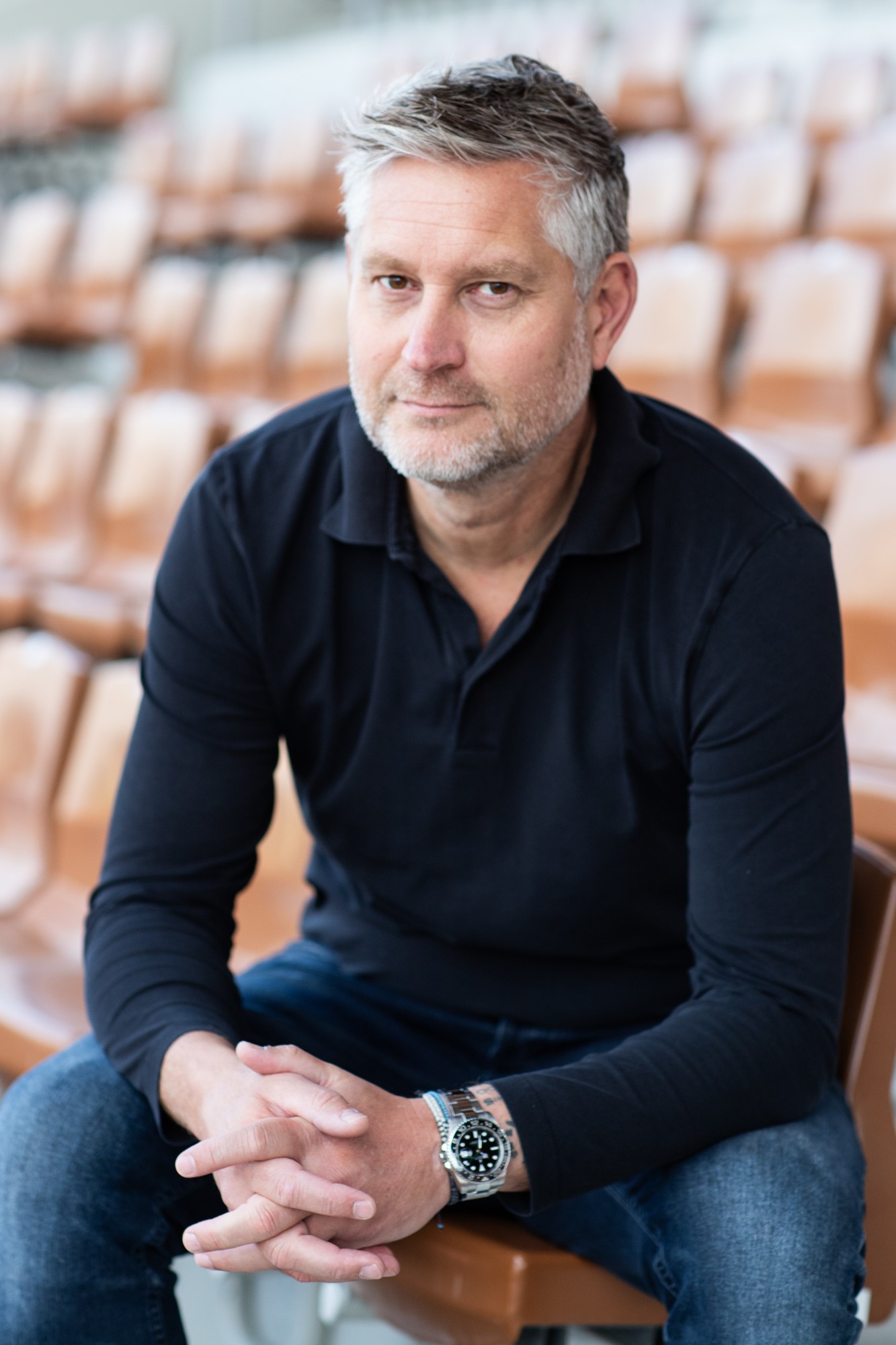 David Dwinger seated in a stadium