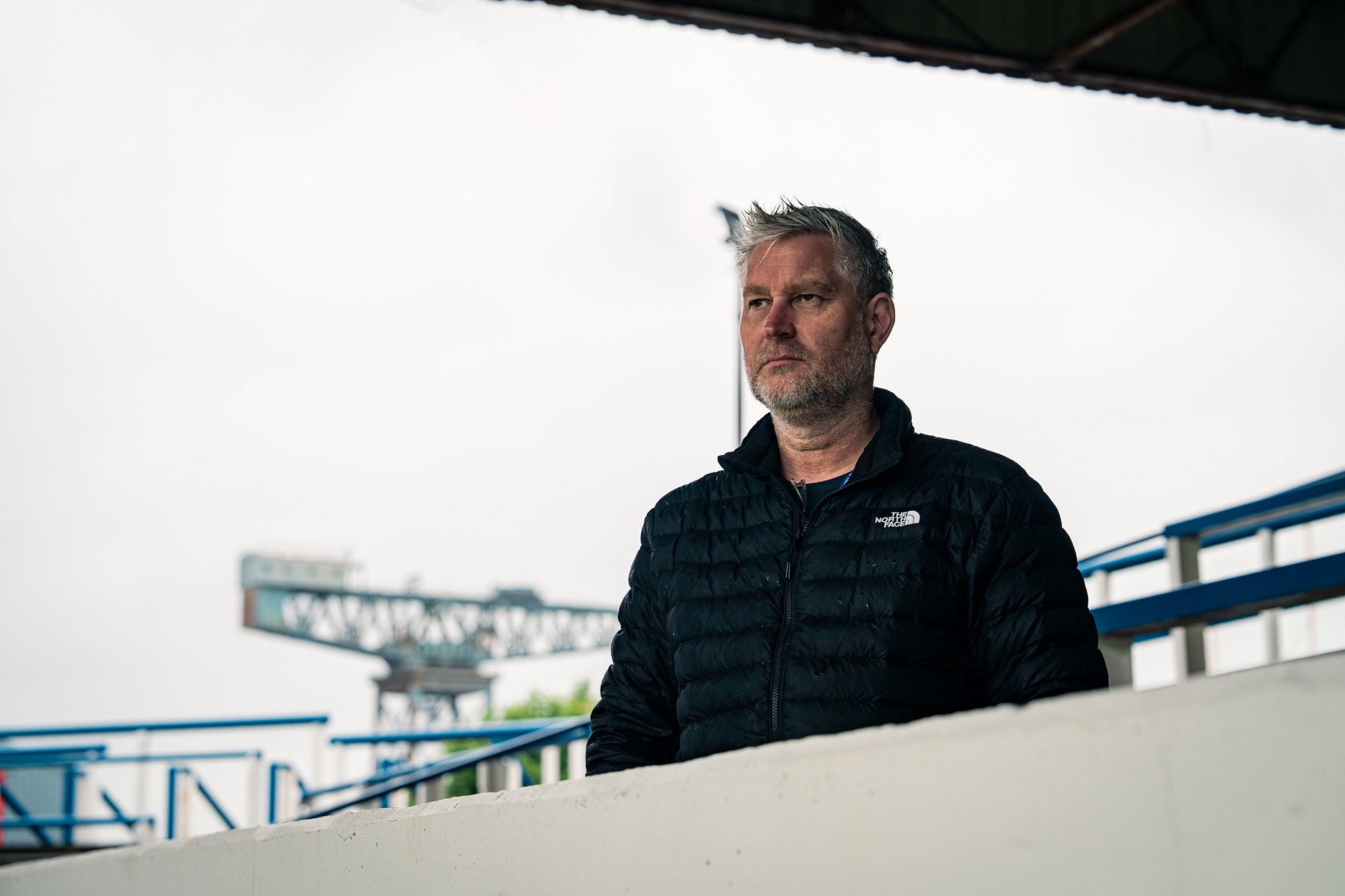 David Dwinger in the stand at a football stadium